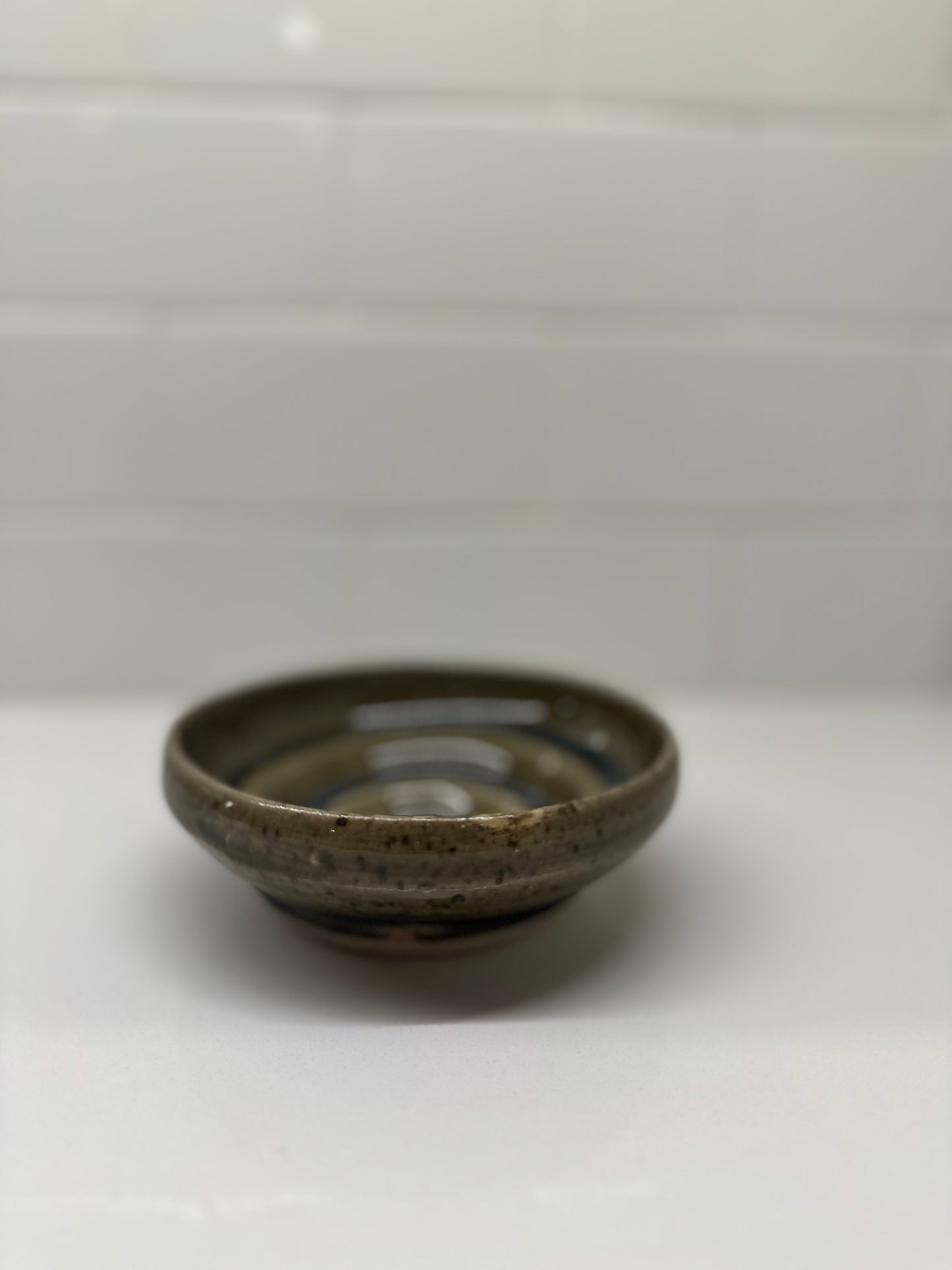 Simple Practice, multi-grooved shallow bowl in amber celadon