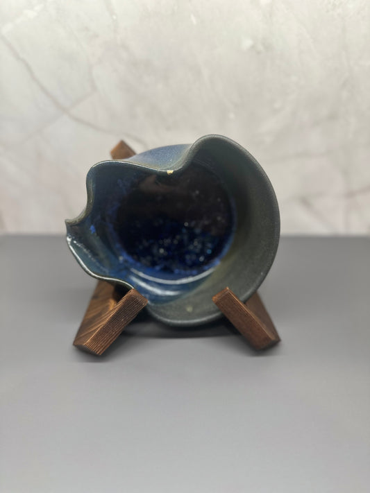 Stylized, shallow vase in deep sea blue